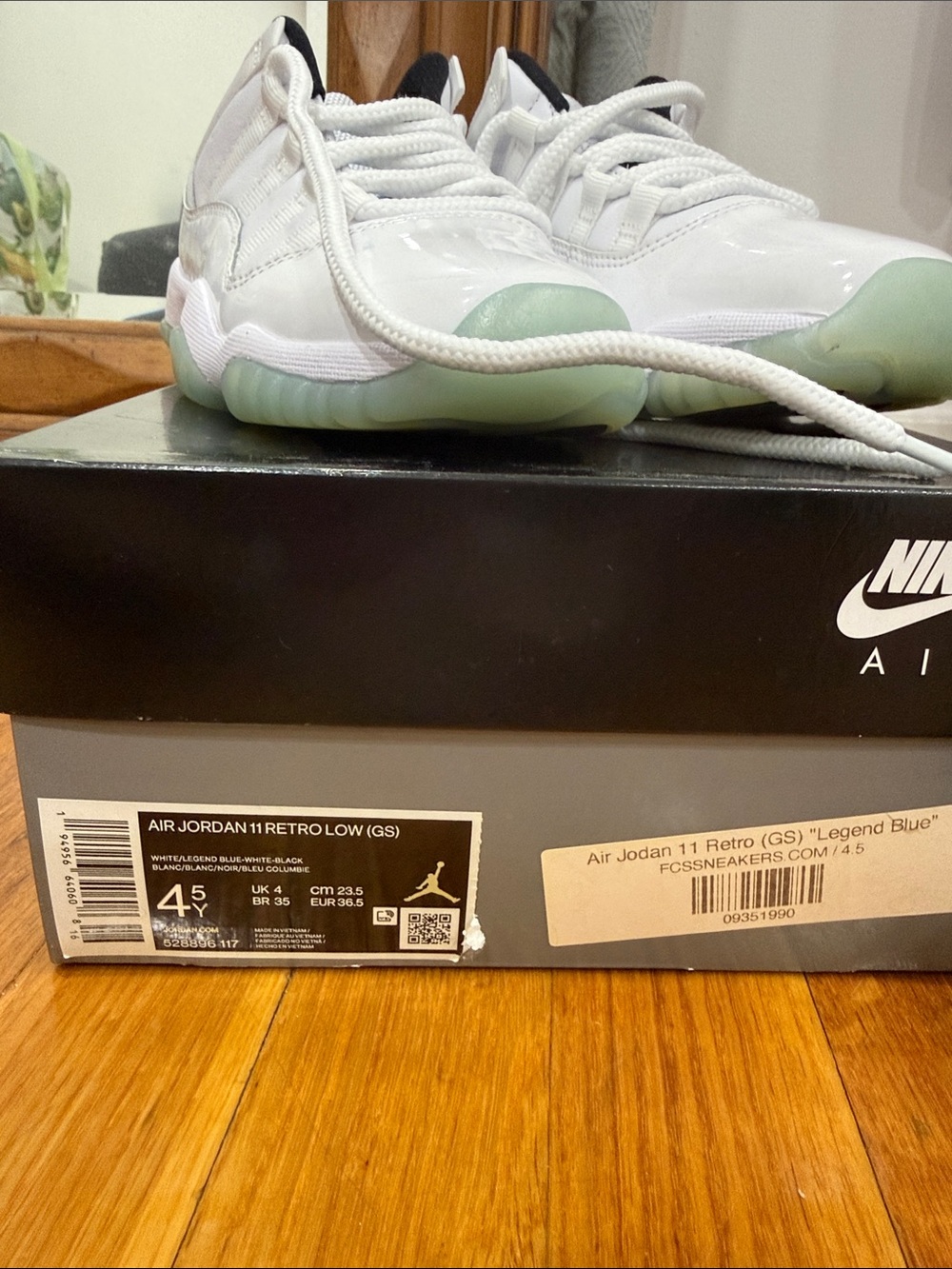 Nike Kids Air Jordan 11 Retro Low in White with Light Blue-Green Sole